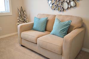 Beige loveseat in a living room