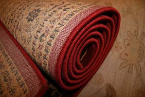 Rolled up rug before rug cleaning